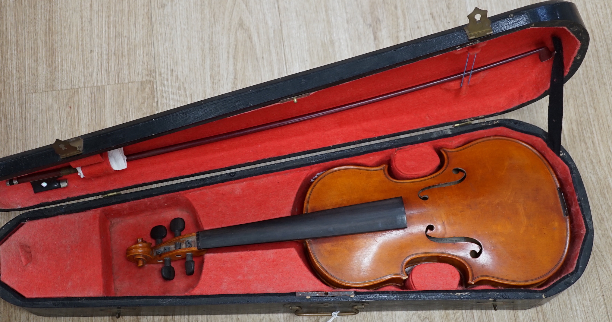 A wooden cased early 20th century French three-quarter size violin by Bonnel Rennes, length of body 33cm, with bow CITES Submission reference HV7BAZUC